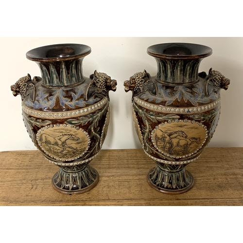 206 - A fine pair of Doulton Lambeth Florence Barlow vases, dated 1877 to base and decorated with four pan... 