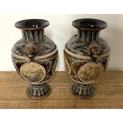 206 - A fine pair of Doulton Lambeth Florence Barlow vases, dated 1877 to base and decorated with four pan... 