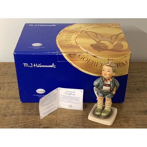 220 - A boxed Goebel M J Hummel figurine 'Sad Sona' with certificate, 6 1/4