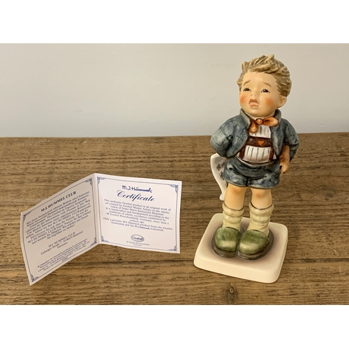 220 - A boxed Goebel M J Hummel figurine 'Sad Sona' with certificate, 6 1/4