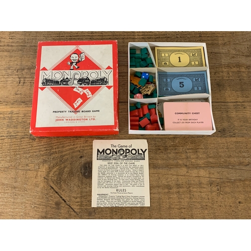 234 - A vintage Trivial Pursuit Mastergame Genius Edition Parker Bros plus a vintage Monopoly game with or... 