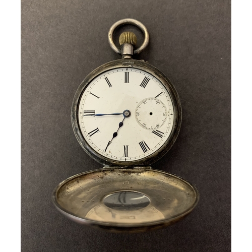 253 - A vintage silver half hunter pocket watch (as found, no glass and no second hand)