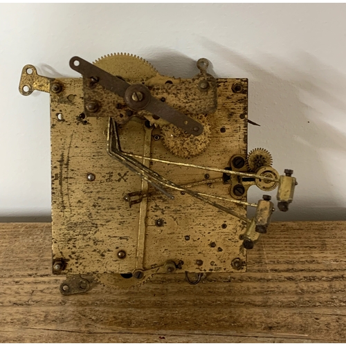 306 - A vintage granddaughter clock movement with pendulum etc