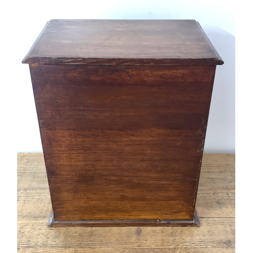 307 - A vintage smokers cabinet with drawers, width 11