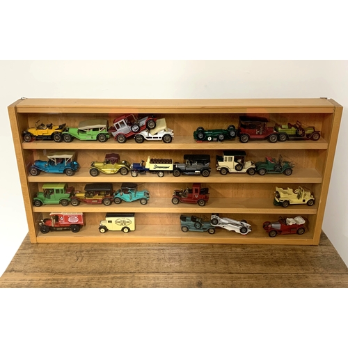 36 - A wood and glazed display case with approx. twenty three Matchbox, Lesney etc die cast cars, mixed a... 