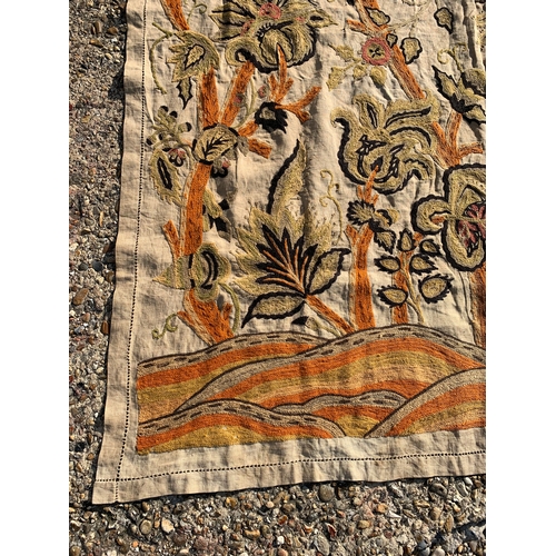 70 - A vintage hand sewn on linen table cloth or single bed cover with floral decoration, approx. 105