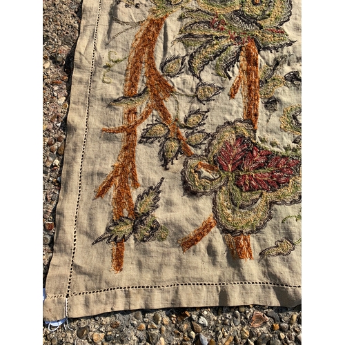 70 - A vintage hand sewn on linen table cloth or single bed cover with floral decoration, approx. 105