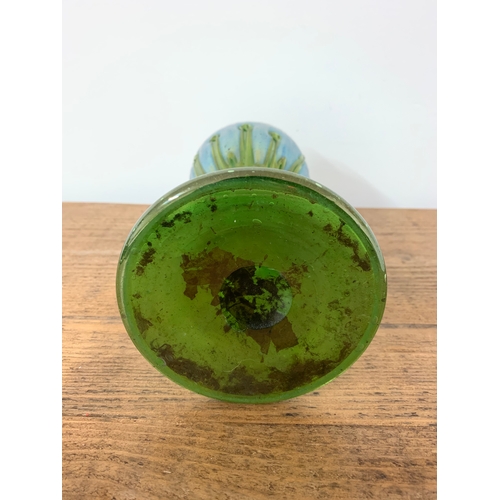 74 - An Art Nouveau iridescent green glass vase in the Loetz style, 9 3/4