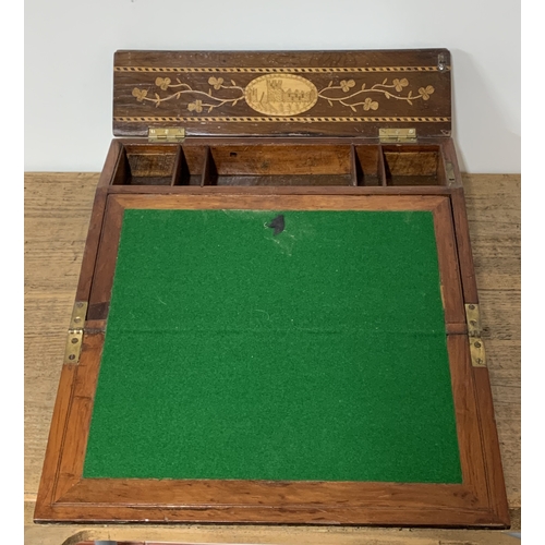 90 - A Victorian inlaid wood fall front writing slope with lift lid, inlaid with a building and floral de... 