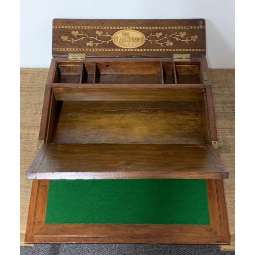 90 - A Victorian inlaid wood fall front writing slope with lift lid, inlaid with a building and floral de... 