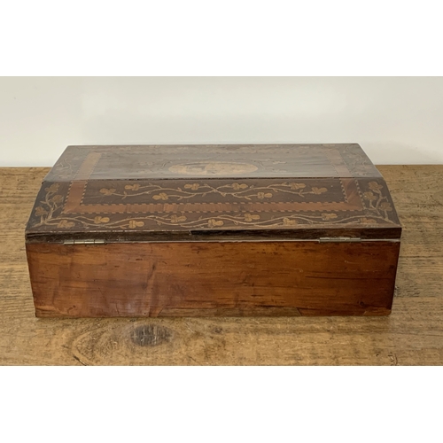 90 - A Victorian inlaid wood fall front writing slope with lift lid, inlaid with a building and floral de... 