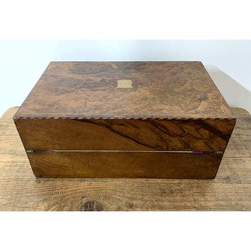 93 - A Victorian burr wood writing slope, brass inlay to edges and cartouche, the inner with replacement ... 