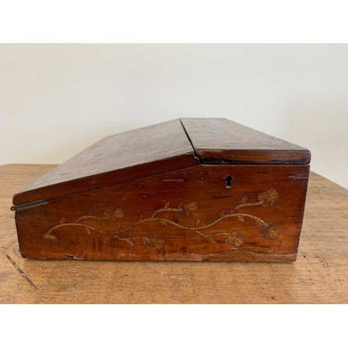 90 - A Victorian inlaid wood fall front writing slope with lift lid, inlaid with a building and floral de... 