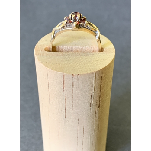 123 - A 9ct gold and red stone ring, approx. size O, weight approx. 2.5g