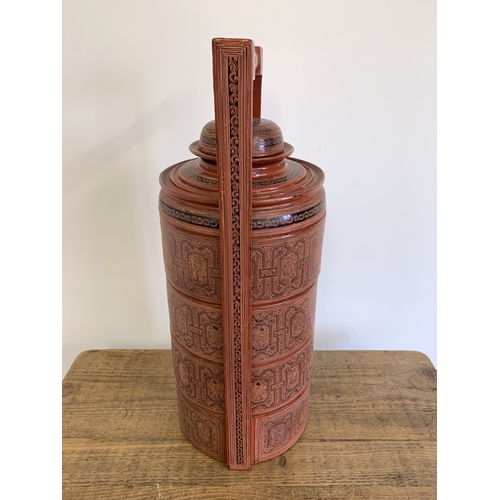 134 - A vintage Burmese Myanmar red lacquer four section food basket/cannisters, hand painted decoration, ... 