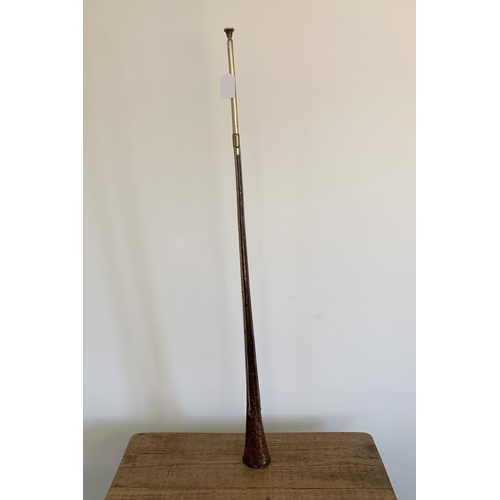 195 - An antique copper with brass strip hunting horn, 41