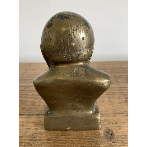 207 - A small but heavy brass bust of Winston Churchill, height approx. 5