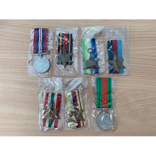 214 - Seven WW2 medals including Burma, Atlantic, Africa, Italy Stars, 1939-45 Star, Defence medal and a 3... 