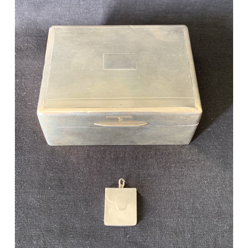 243 - A hallmarked silver cigarette box, marks rubbed, with wood lined interior, 4 1/2