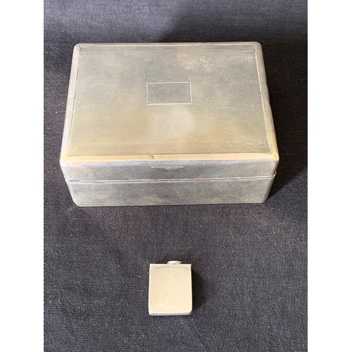 243 - A hallmarked silver cigarette box, marks rubbed, with wood lined interior, 4 1/2