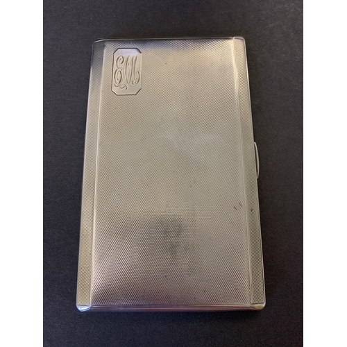 244 - A large and heavy hallmarked silver cigarette case, Birmingham 1936, inscription inside lid 'Present... 