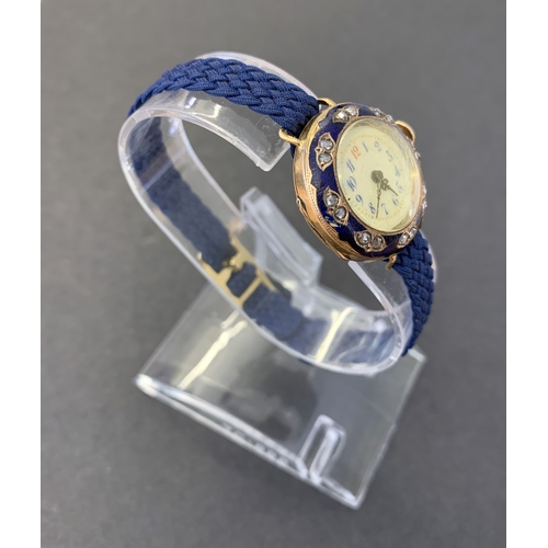 250 - A late 19th/early 20th Century 18ct gold and diamond set ladies wristwatch with blue enamel decorati... 