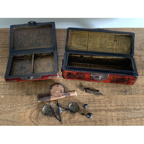 295 - Two Chinese decorative red boxes with brass fittings plus a set of opium scales with Hintha bird wei... 