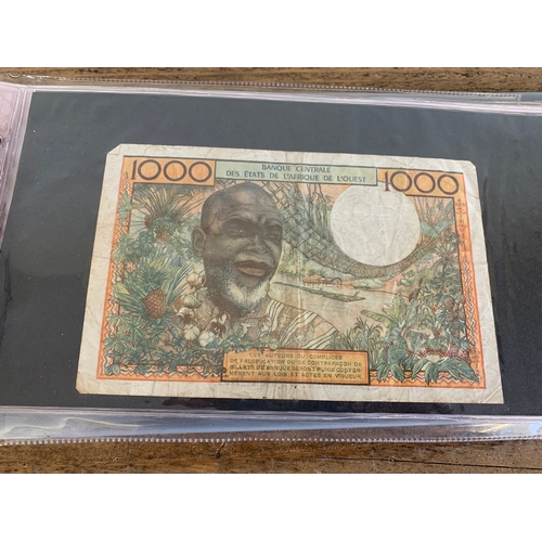 302 - An album of mixed bank notes, French, German plus others