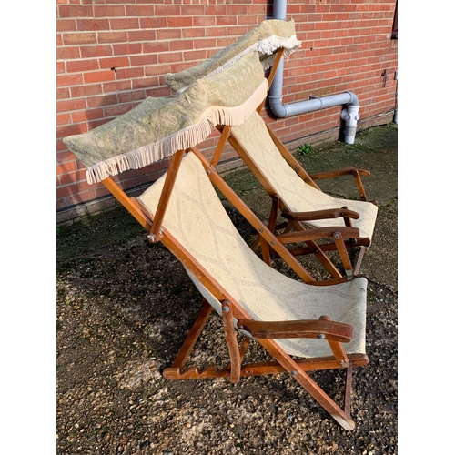 316 - Two vintage cloth steamer deck chairs with canopies