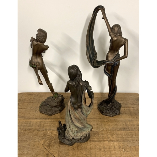 323 - Three resin female figurines, the tallest 19