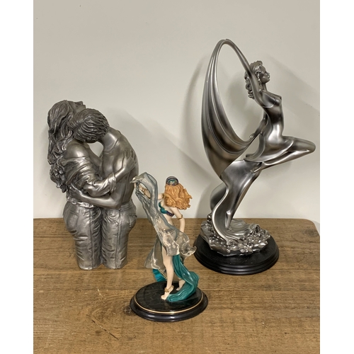 324 - Three resin female figurines, the tallest 18 1/2