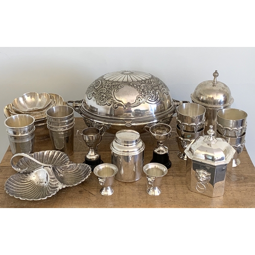 33 - A box of silver plated wares including a large roll top tureen, beakers etc