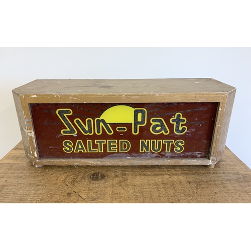 37 - A vintage 'Sun-Pat Salted Nuts' illuminated advertising display box, has the mechanism inside with a... 