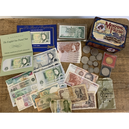 45 - A vintage one pound and a five pound note, foreign notes, loose coinage etc