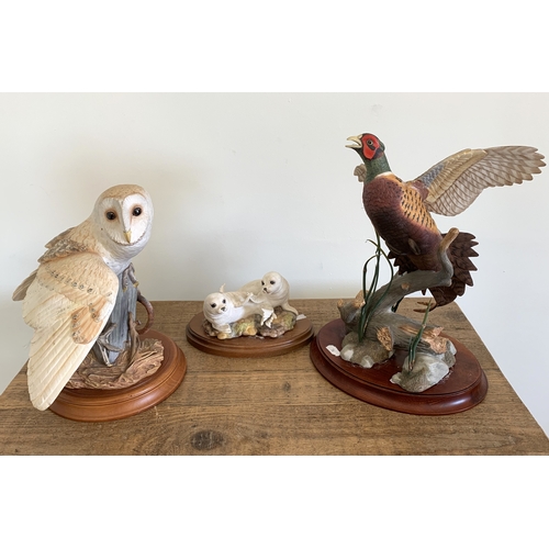 47 - Franklin Mint 'The Ring Neck Pheasant' (loose from base), a barn owl and 'Young Seals' (loose from b... 