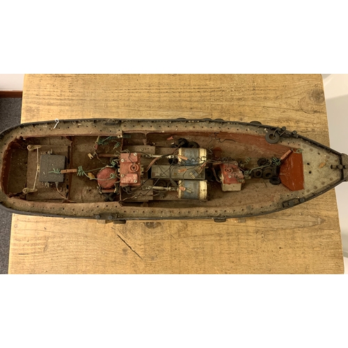 64 - A small vintage remote controlled boat, hull only (inside as found, no controller), 24