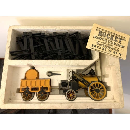 65 - A boxed Hornby Stephensons Rocket Real Steam Train Set with extra track (box with age related wear)