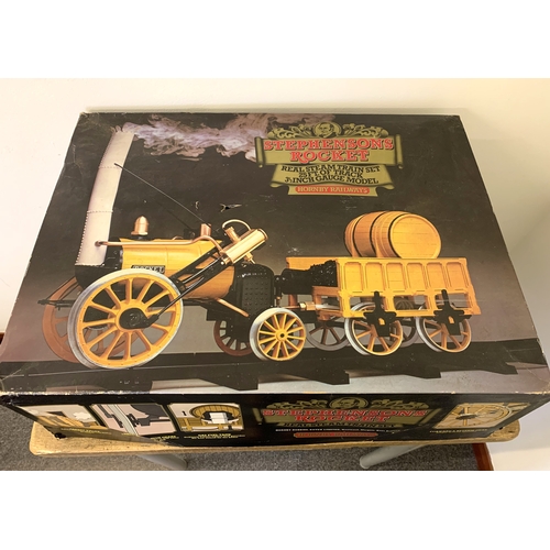 65 - A boxed Hornby Stephensons Rocket Real Steam Train Set with extra track (box with age related wear)