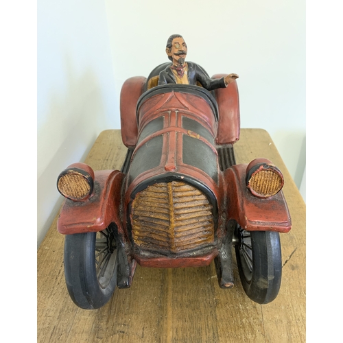 70 - A large model of a vintage car with driver, approx. 19