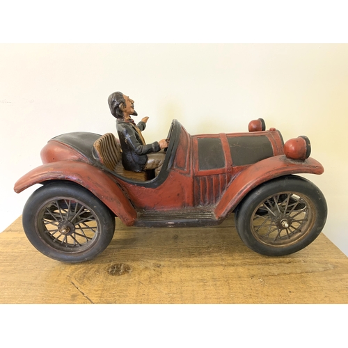 70 - A large model of a vintage car with driver, approx. 19