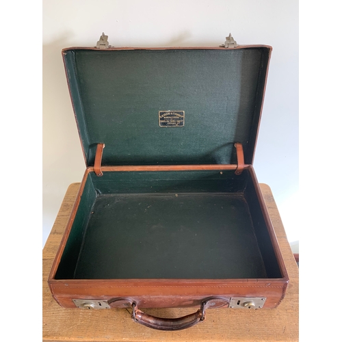 88 - A vintage D.H. Evans & Company Ltd small leather brief/suitcase, initials to top G.F.F., measures 20... 