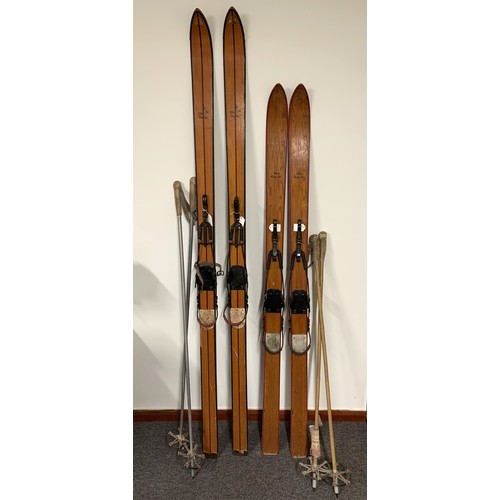 314 - Two pairs of ladies and gents 1930's ski's with poles