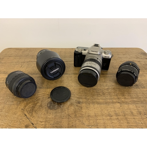 200 - A vintage Pentax M250 SLR film camera with a Pentax 28/80 lens plus two other Pentax lenses 35x70 an... 