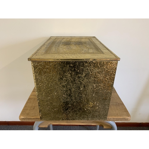 205 - A large brass embossed log box, 23