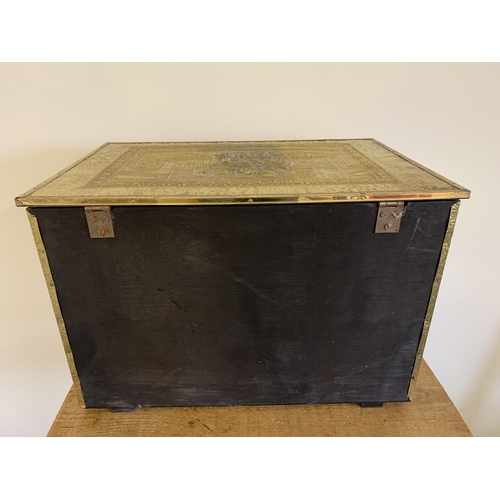 205 - A large brass embossed log box, 23