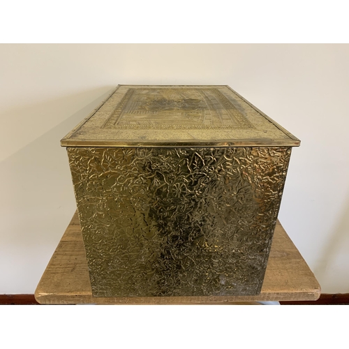 205 - A large brass embossed log box, 23