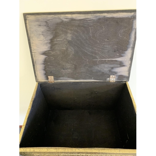 205 - A large brass embossed log box, 23