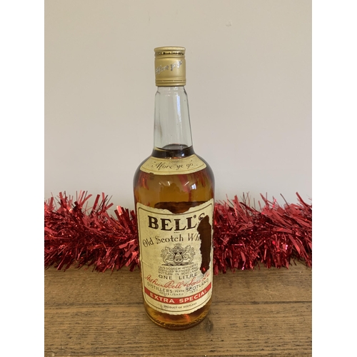 40 - Circa 1970's Bell's Extra Special Old Scotch whisky, one litre (tear to label)