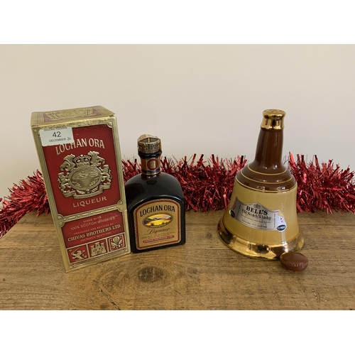 42 - A boxed Lochan Ora liqueur whisky plus a 26 2/3 fl oz Bell's bell (cork lid as found)