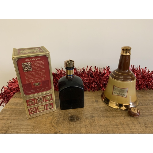 42 - A boxed Lochan Ora liqueur whisky plus a 26 2/3 fl oz Bell's bell (cork lid as found)